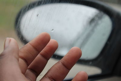 Close-up of hand holding water