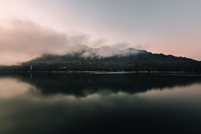 Scenic view of lake against sky during sunset