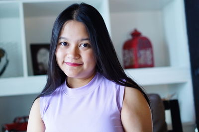 Portrait of smiling woman at home
