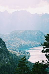 Sun shinning through the mountains and the lake