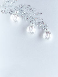 Directly above shot of christmas decorations on white background