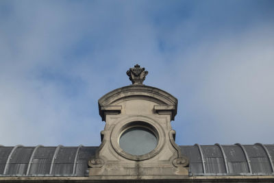 Low angle view of statue against building