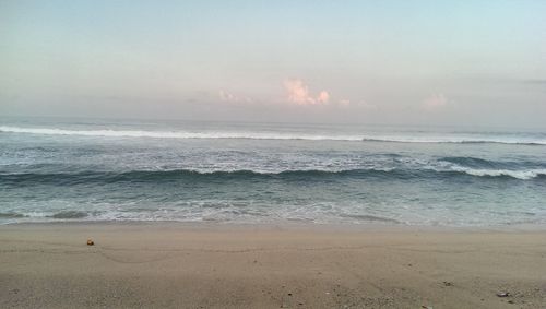 Scenic view of beach against sky during sunset