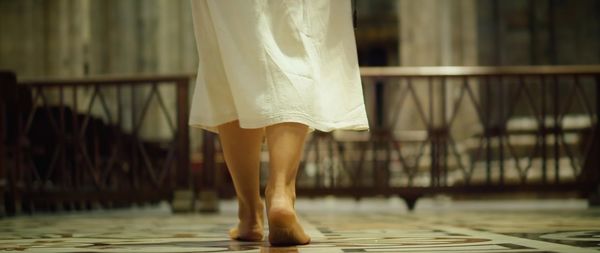 Low section of woman standing on floor