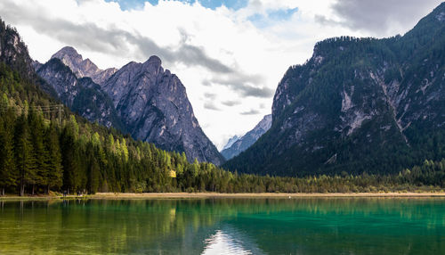 Scenic view of lake and mountains against sky