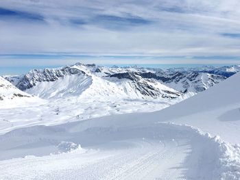 Scenic view of snow covered mountains