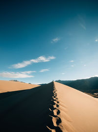 Scenic view of land against sky during sunset