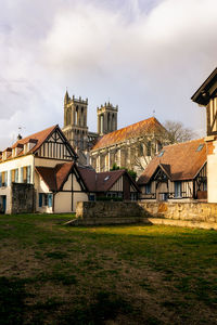 Houses on field against sky
