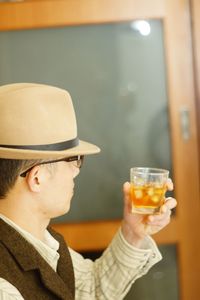 Side view of woman drinking glass