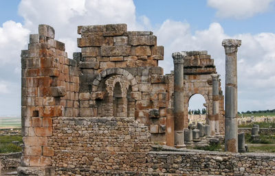 Historic building against cloudy sky