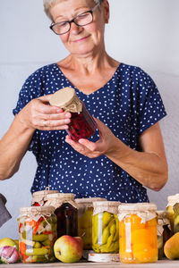 Midsection of woman holding ice cream