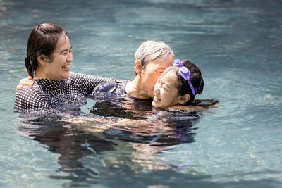 Portrait of woman swimming in pool