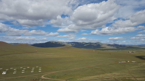 Scenic view of mountains against cloudy sky