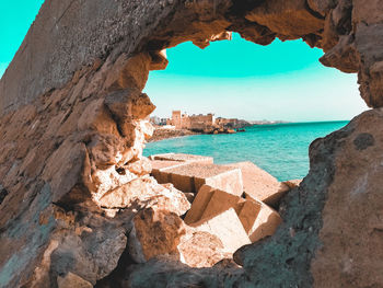 Scenic view of sea shore against sky