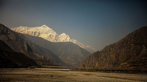 Scenic view of snowcapped mountains against sky