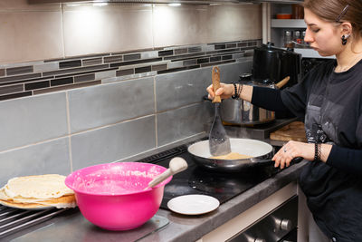 Man preparing food in kitchen