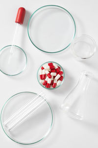 High angle view of glasses on table against white background