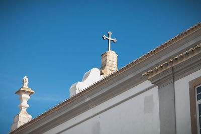 Low angle view of building against blue sky