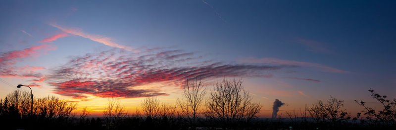 Scenic view of silhouette trees against sky during sunset