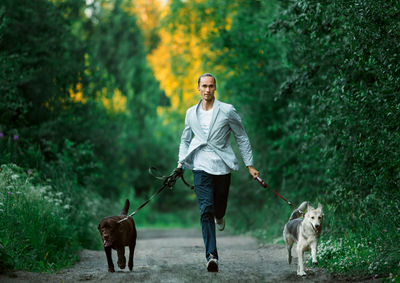 Full length of man with dog