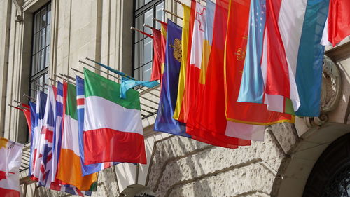Low angle view of national flags on wall