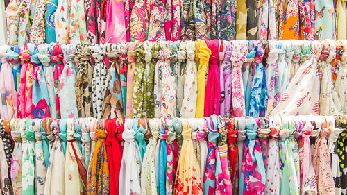 Full frame shot of multi colored scarves hanging for sale