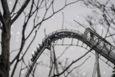 Low angle view of ferris wheel against sky