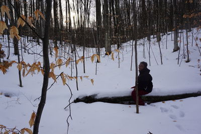 Woman on snow covered land