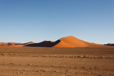 Scenic view of desert against clear sky