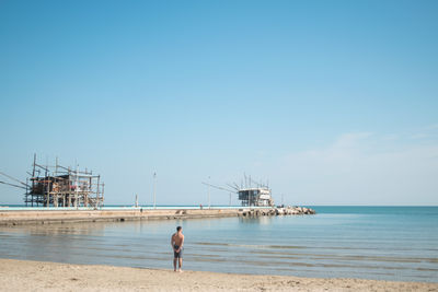 Scenic view of sea against clear blue sky