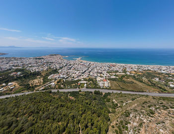 Scenic view of sea and buildings against sky