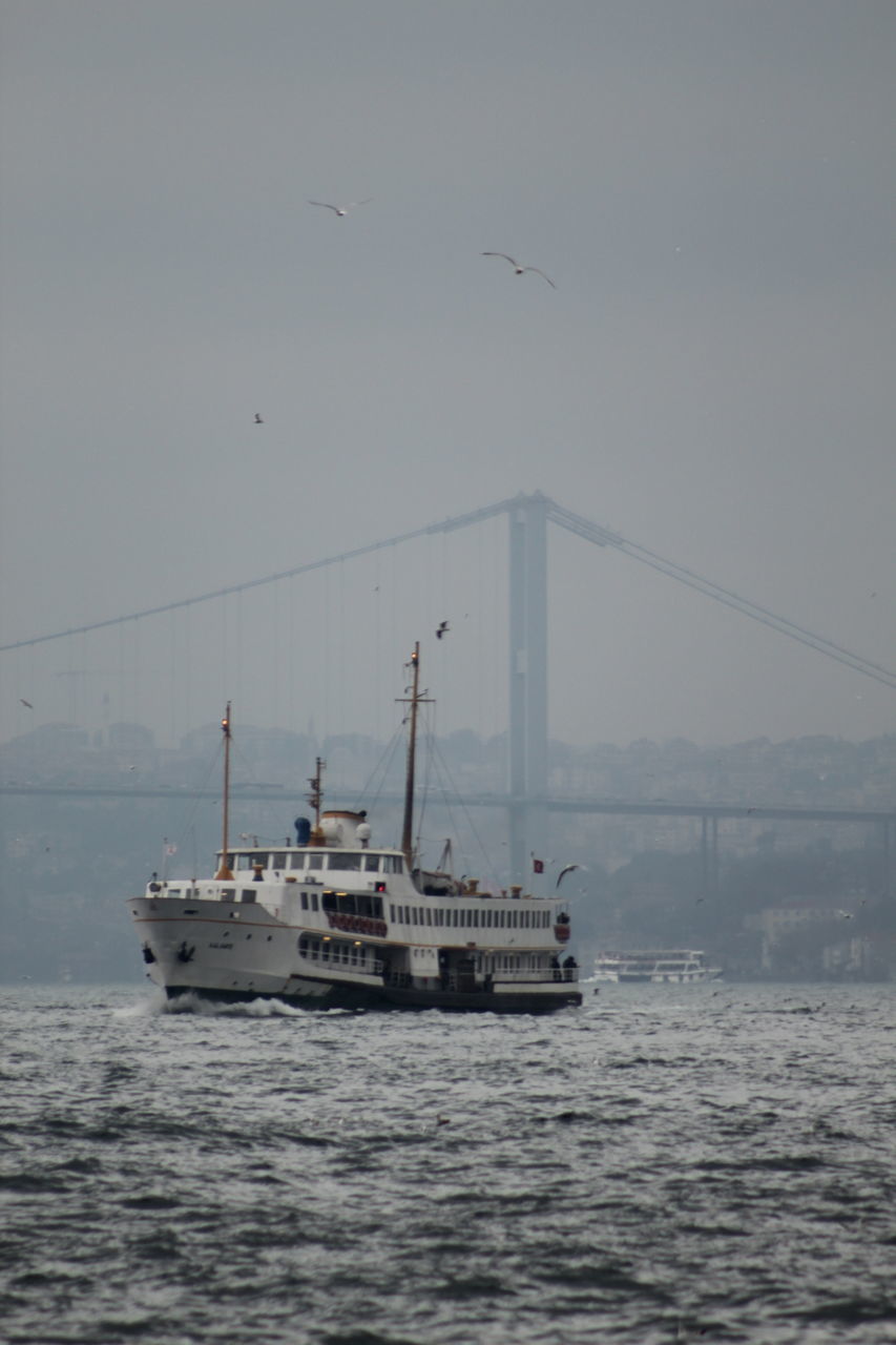 nautical vessel, transportation, sea, water, nature, outdoors, mode of transport, waterfront, day, no people, flying, sky, bird, animal themes