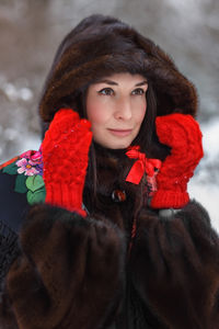 Portrait of young woman wearing warm clothing
