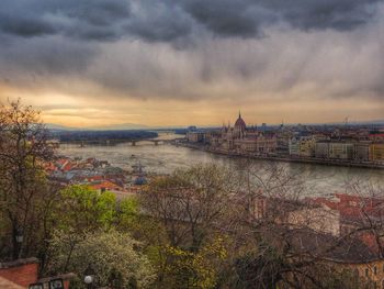 Cityscape against cloudy sky