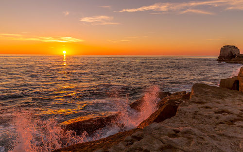 Scenic view of sea against sky during sunset