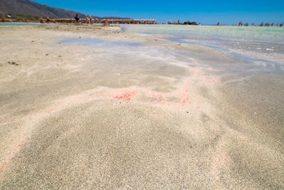 Surface level of beach against sky