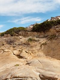 Rock formation on land against sky