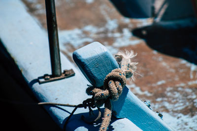 High angle view of rope tied up on metal