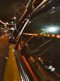 High angle view of illuminated city street at night