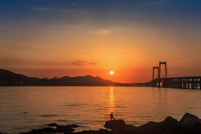 Scenic view of sea against sky during sunset