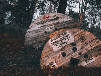 Information sign on tree trunk in field