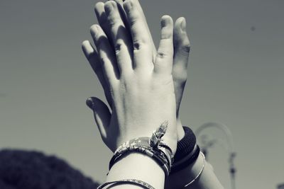 Close-up of hands doing high-five