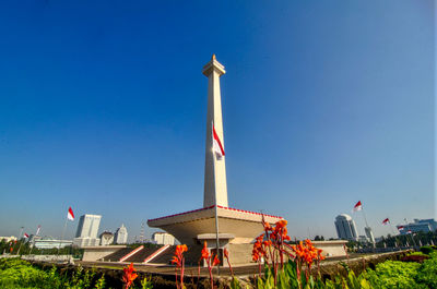 Low angle view of tower against clear blue sky