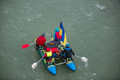 High angle view of people sailing boat on sea