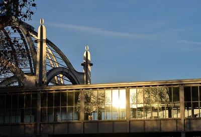 Low angle view of bridge and building against sky