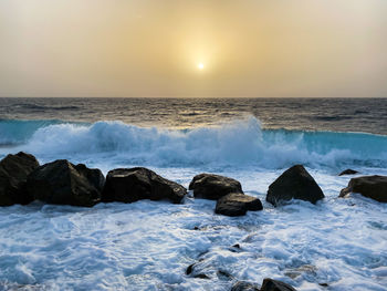 Scenic view of sea against sky during sunset