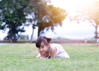 Portrait of woman on grassy field