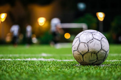 Close-up of soccer ball on field