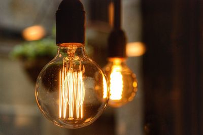 Close-up of illuminated light bulb