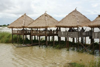 Built structure in water against sky